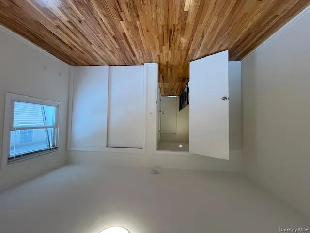 Unfurnished bedroom with light wood-type flooring and a closet Unfurnished bedroom with light wood-type flooring and a closet
