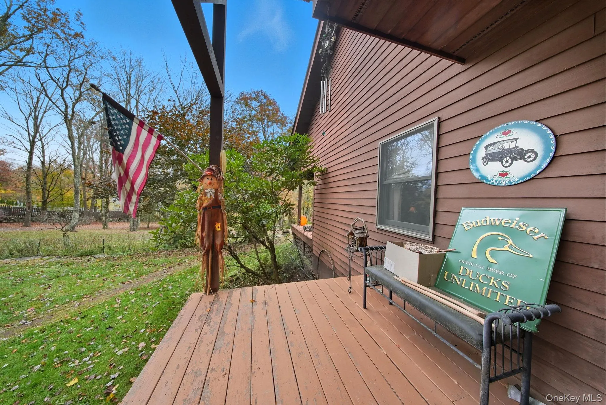 Side Entrance into Hall - Wooden terrace featuring a yard Side Entrance into Hall - Wooden terrace featuring a yard