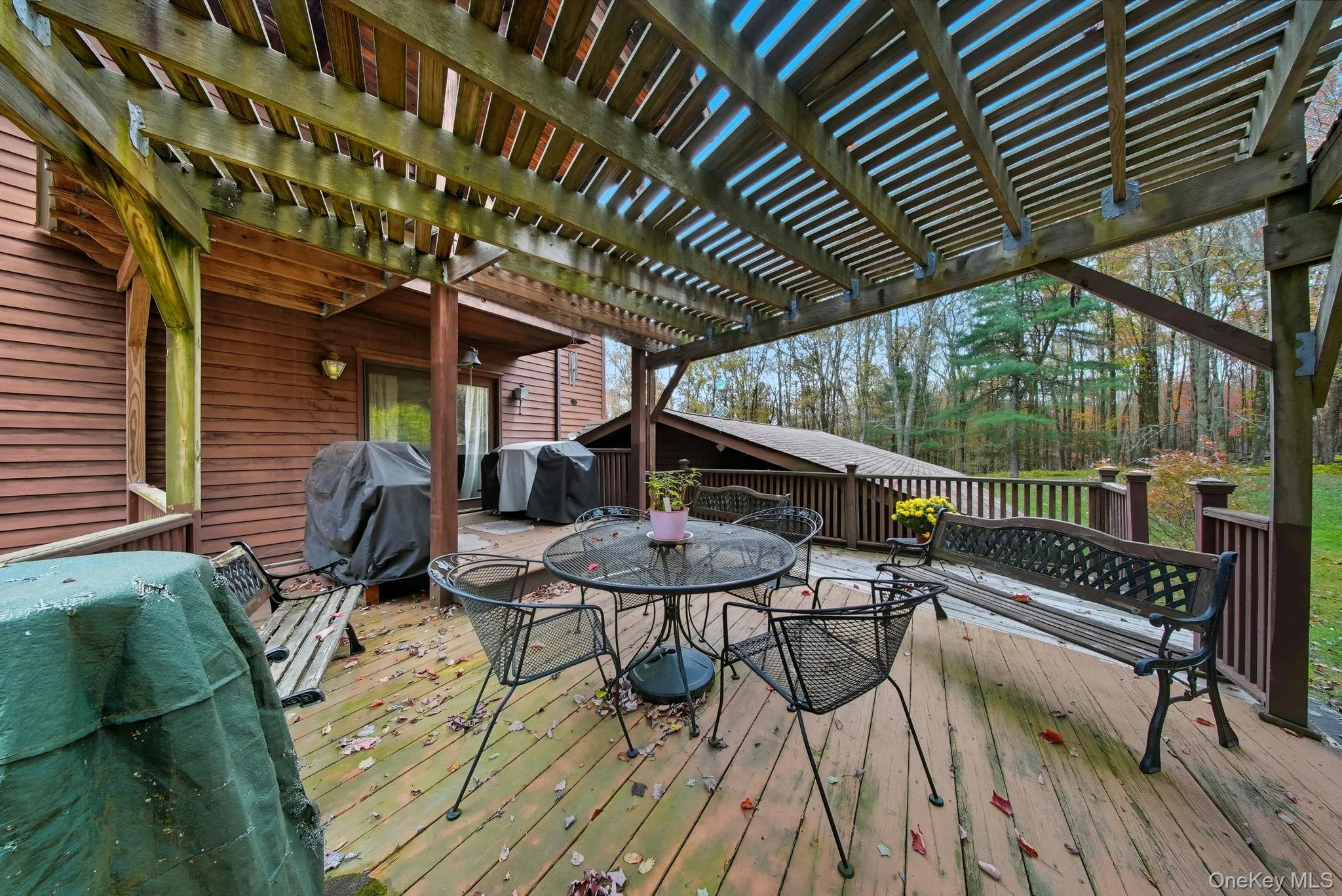 Wooden deck featuring outdoor dining space and grilling area - Outside the Dining Room Wooden deck featuring outdoor dining space and grilling area - Outside the Dining Room