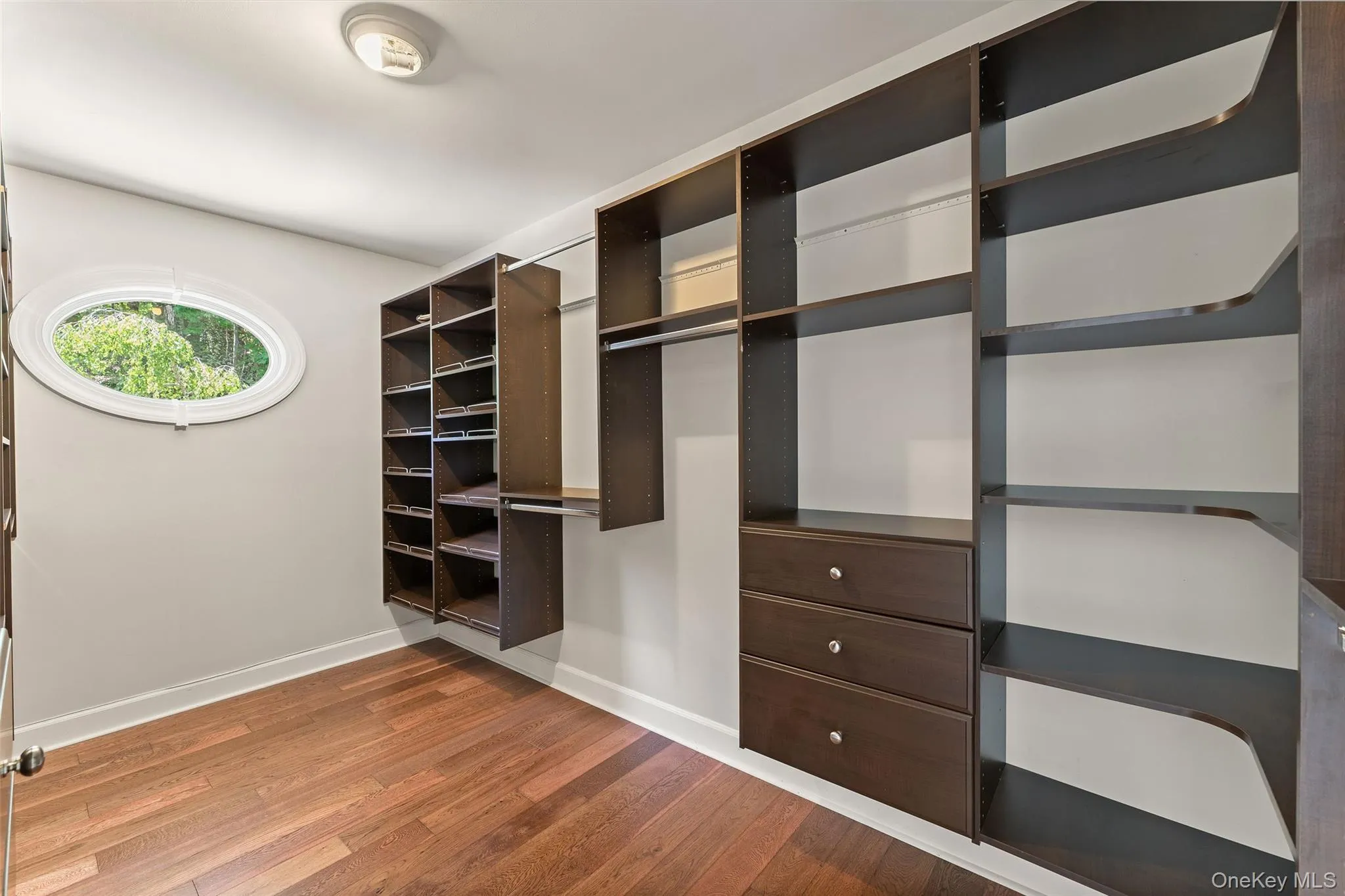 Primary Bedroom Walk-in Closet Primary Bedroom Walk-in Closet