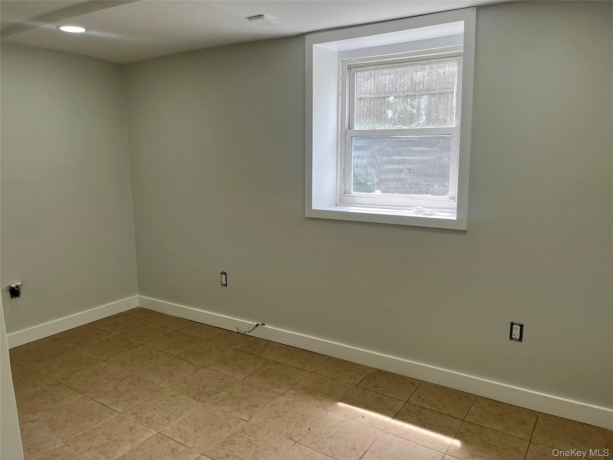 Empty room featuring baseboards Empty room featuring baseboards