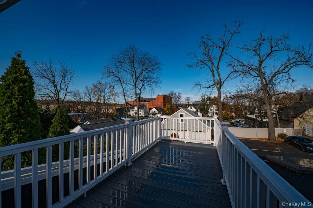 Wooden deck featuring view of Huntington Village and The Paramount Wooden deck featuring view of Huntington Village and The Paramount