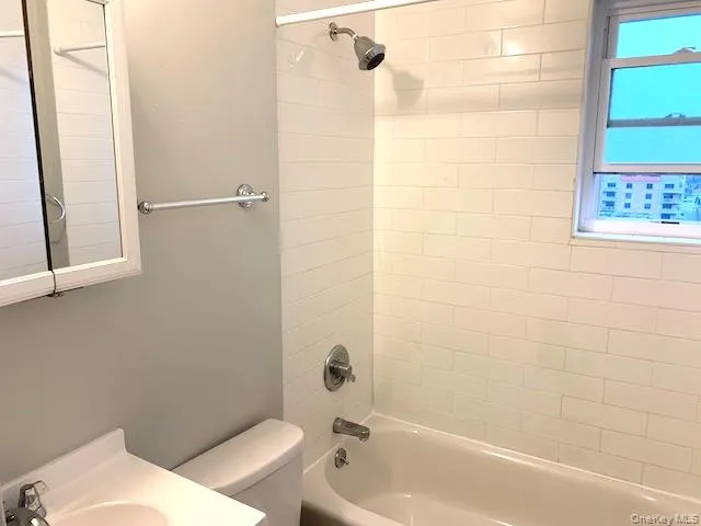 Full bath with shower / bath combination and vanity Full bath with shower / bath combination and vanity