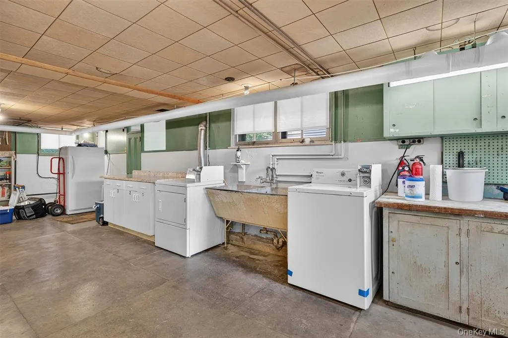 Laundry area in the basement includes coin operated washer and dryer Laundry area in the basement includes coin operated washer and dryer