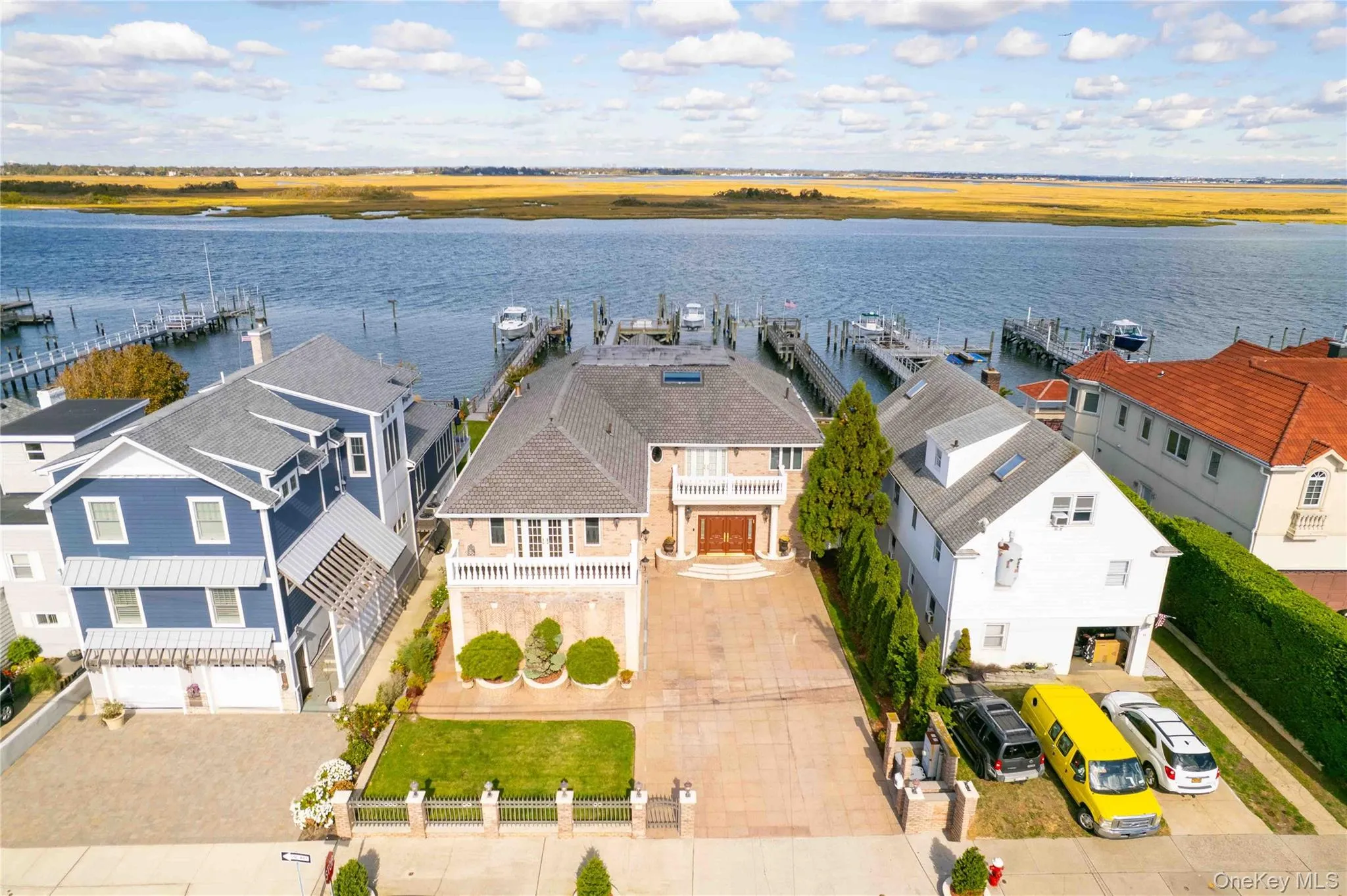 Aerial perspective of suburban area with a large body of water Aerial perspective of suburban area with a large body of water