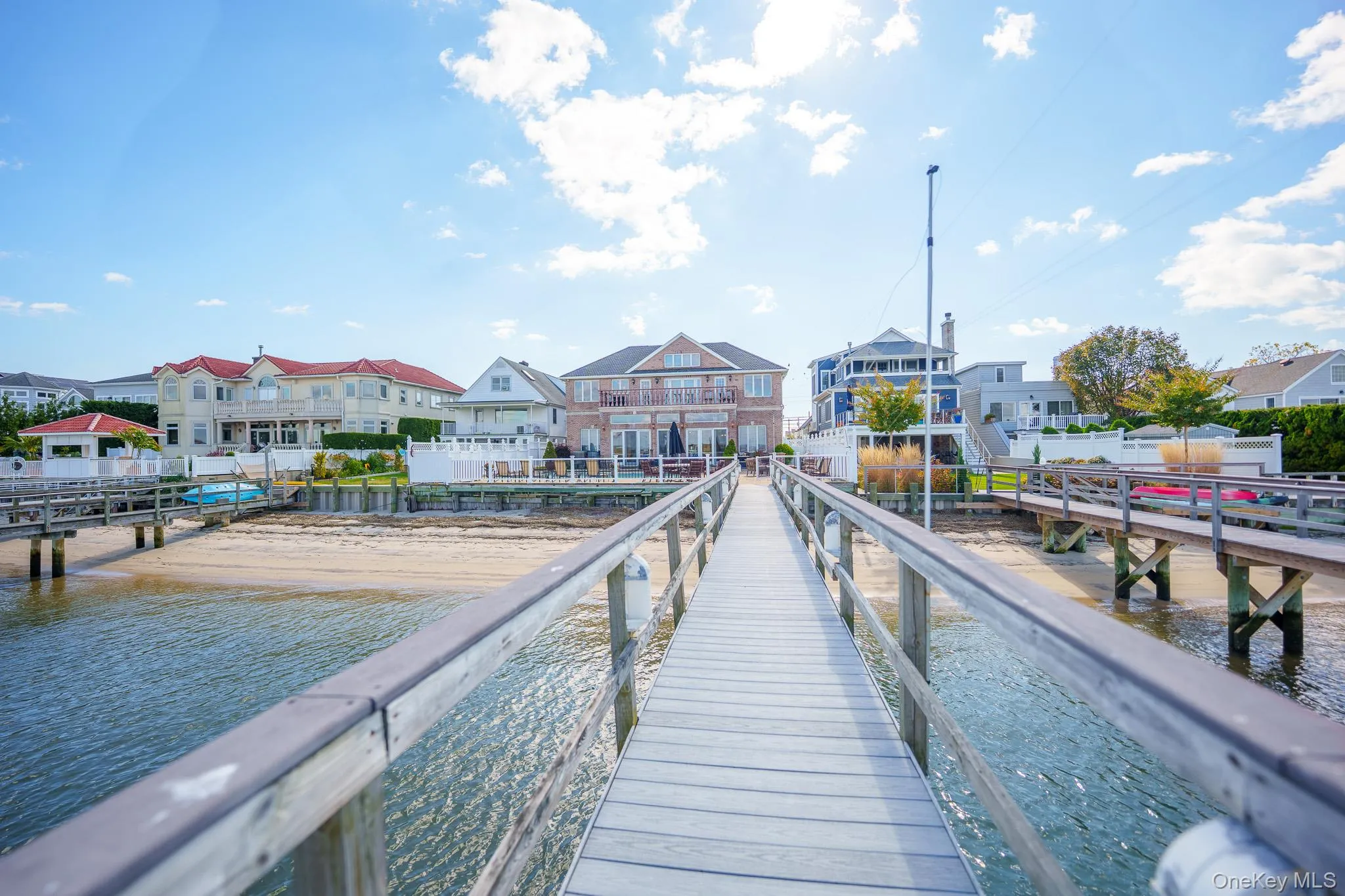 Dock area featuring a residential view and a water view Dock area featuring a residential view and a water view