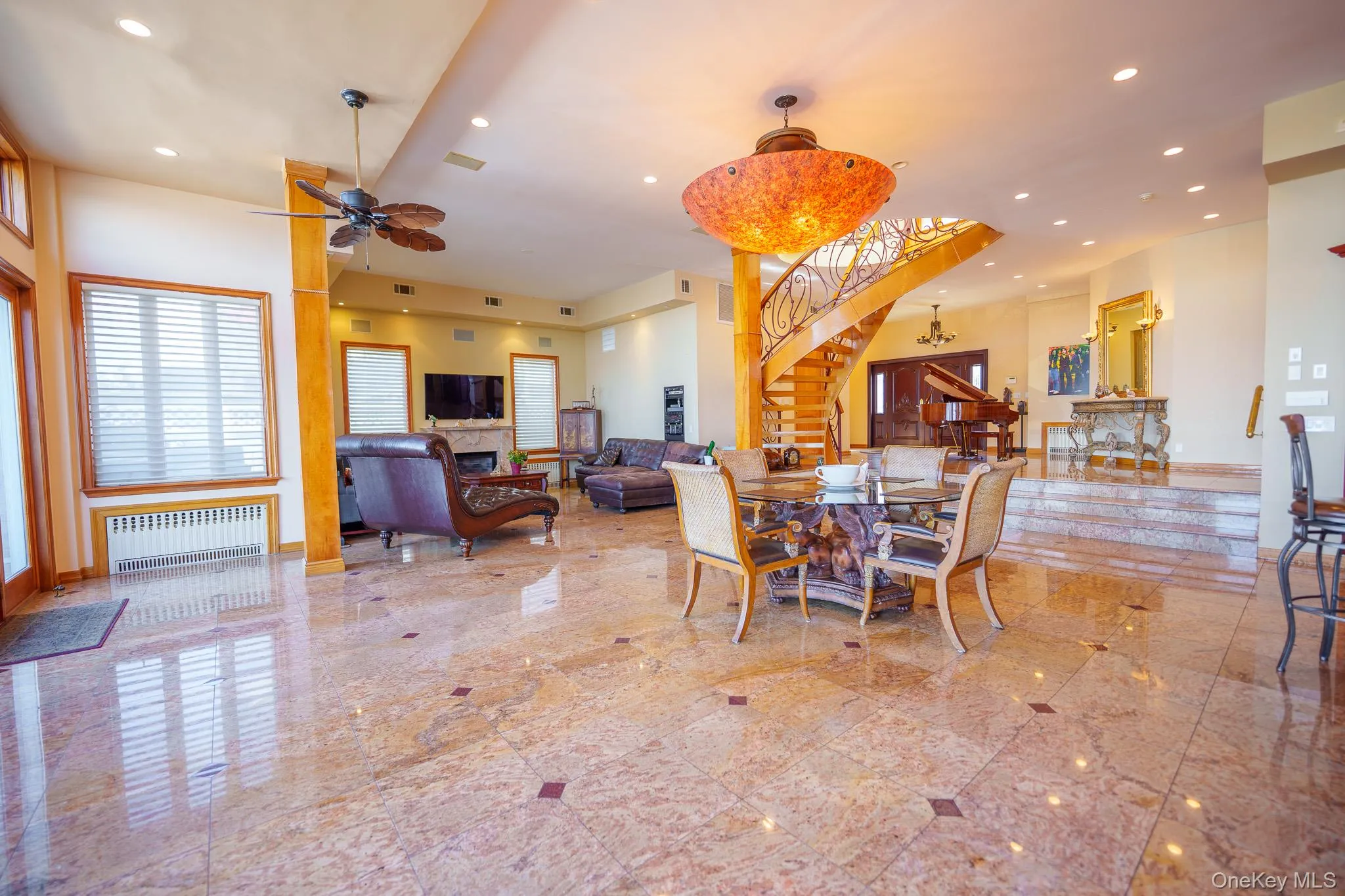 Dining area with recessed lighting, stairway, radiator, and a ceiling fan Dining area with recessed lighting, stairway, radiator, and a ceiling fan