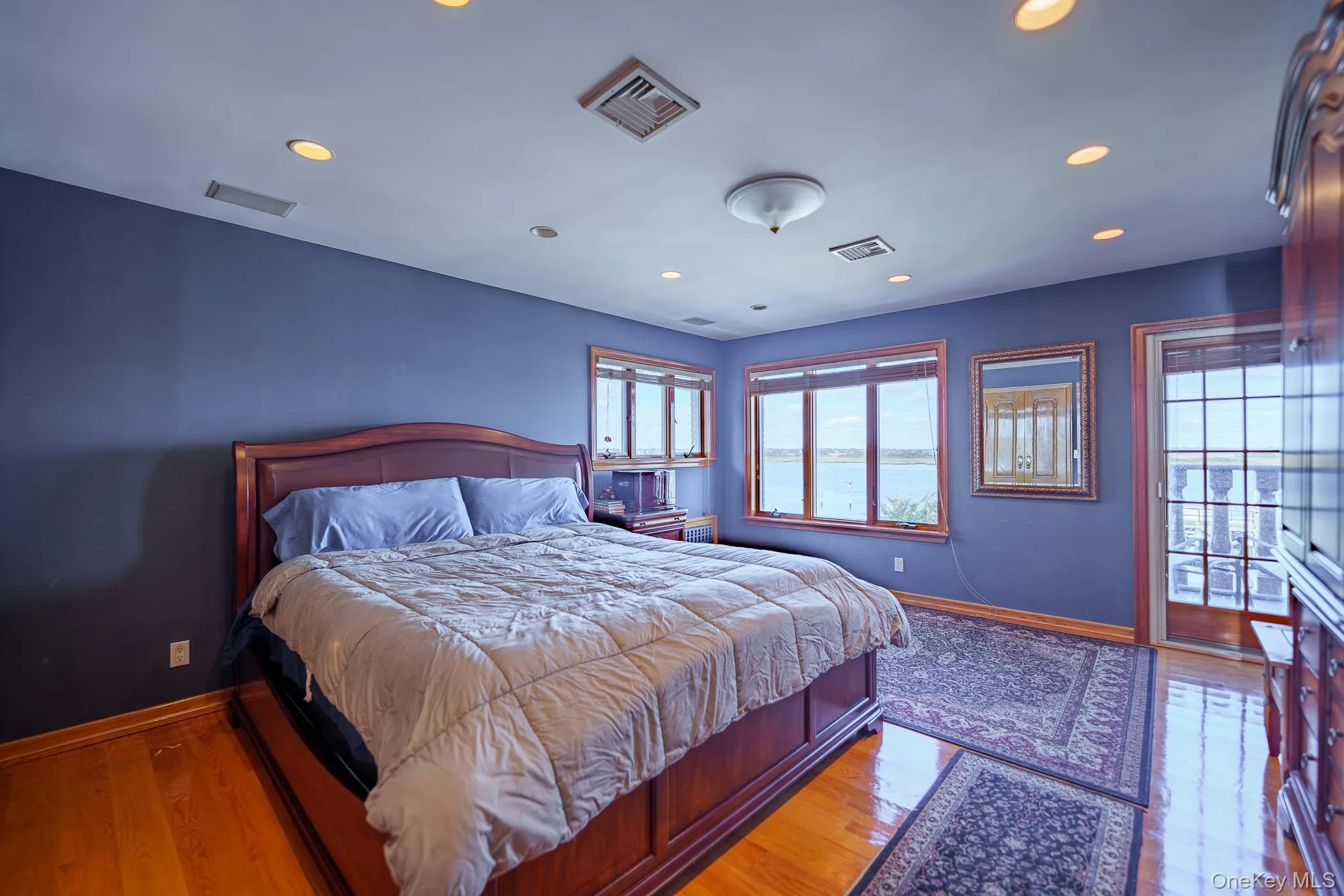 Bedroom featuring recessed lighting and wood finished floors Bedroom featuring recessed lighting and wood finished floors