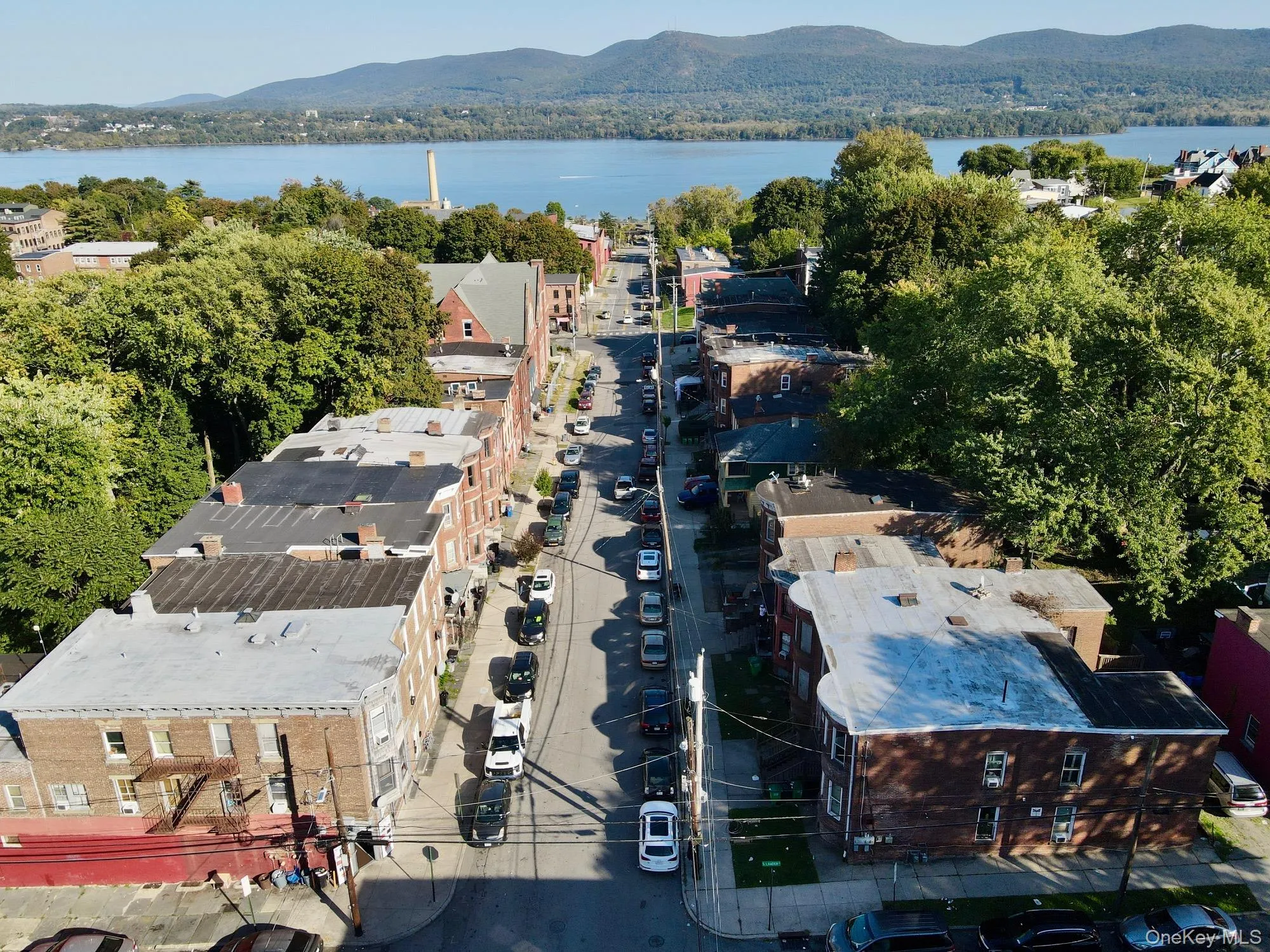 Drone / aerial view of a water and mountain view Drone / aerial view of a water and mountain view