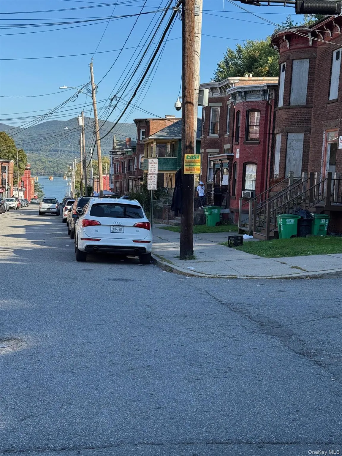View of asphalt street with street lighting, curbs, sidewalks View of asphalt street with street lighting, curbs, sidewalks