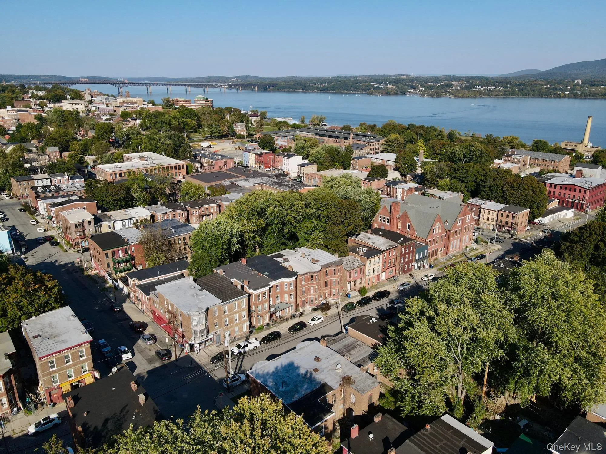View of property location featuring a nearby body of water and bridge View of property location featuring a nearby body of water and bridge