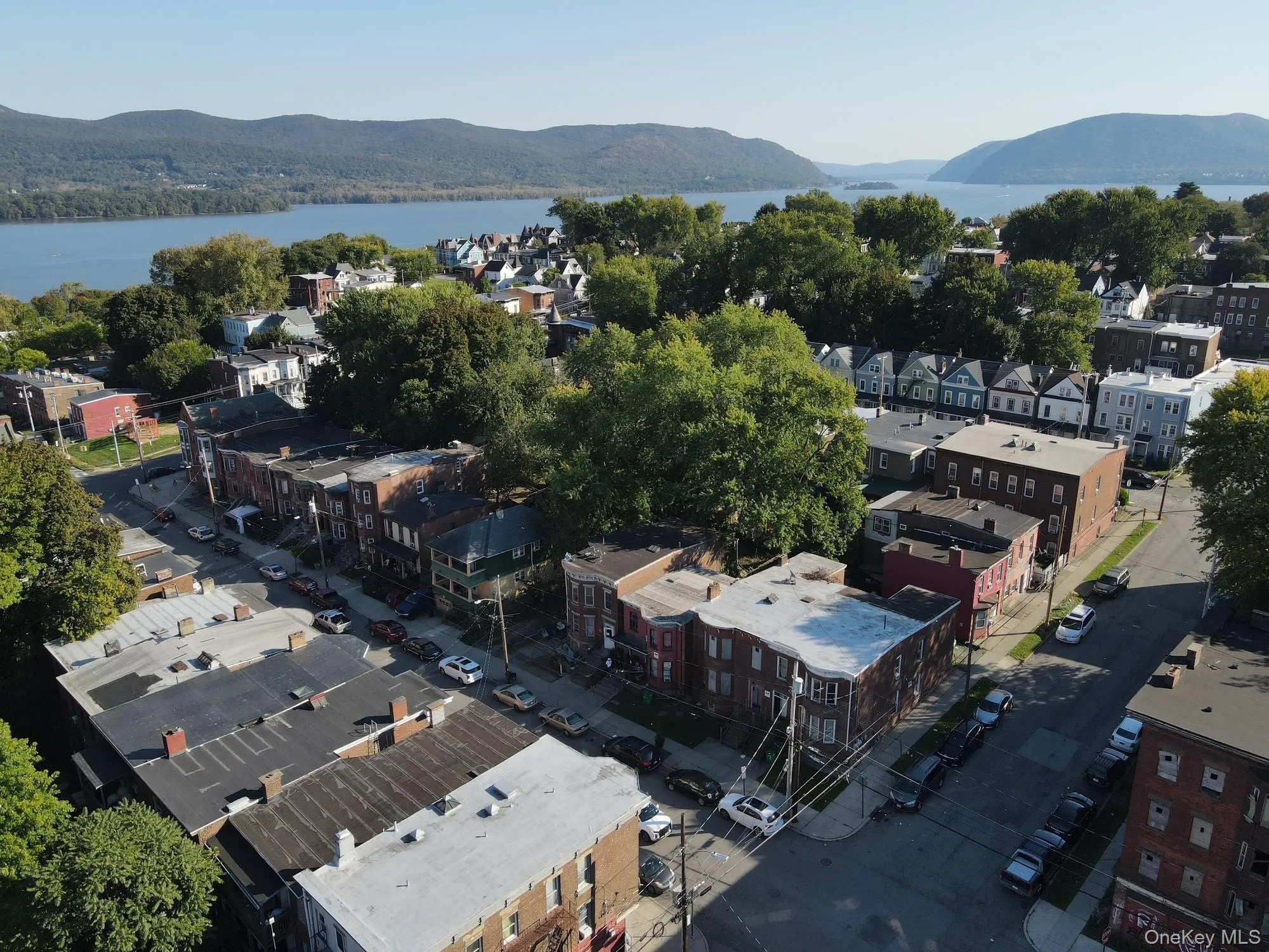Aerial view of property and surrounding area with a water and mountain view Aerial view of property and surrounding area with a water and mountain view