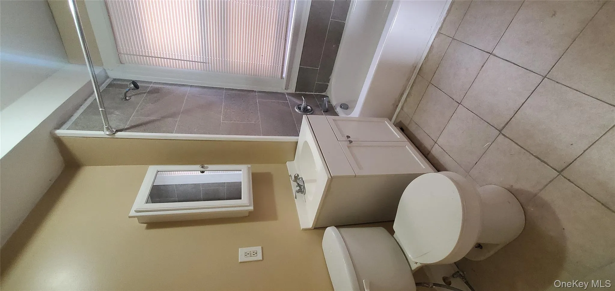 Bathroom with vanity, shower combination, and light tile patterned flooring Bathroom with vanity, shower combination, and light tile patterned flooring