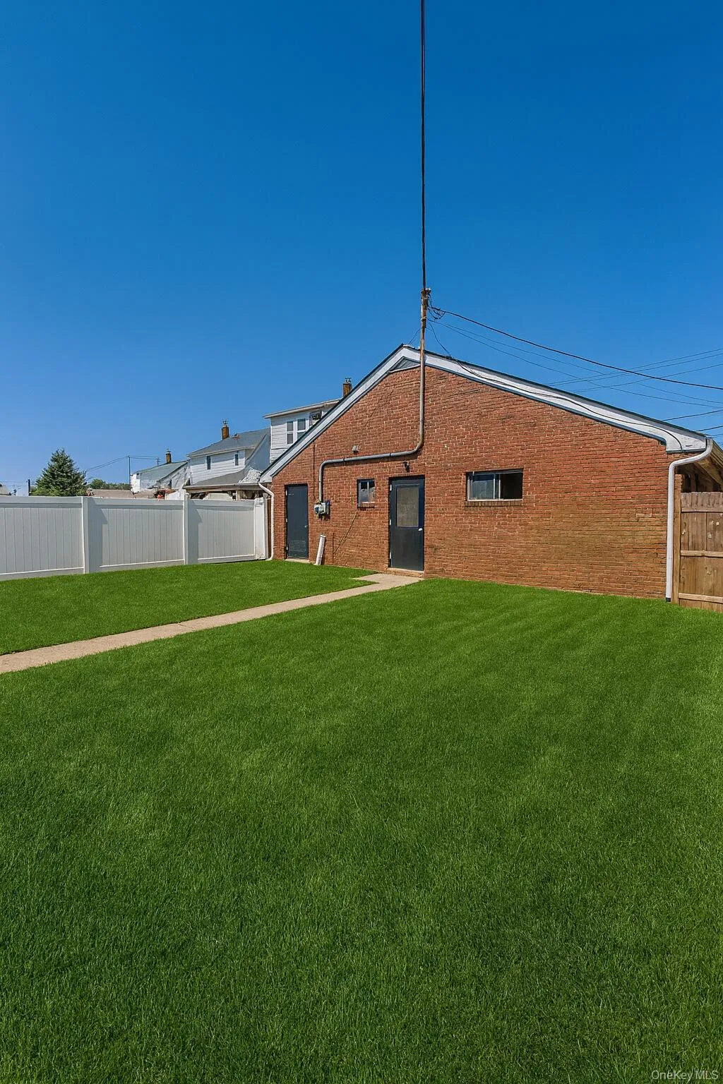 Back of property with brick siding Back of property with brick siding