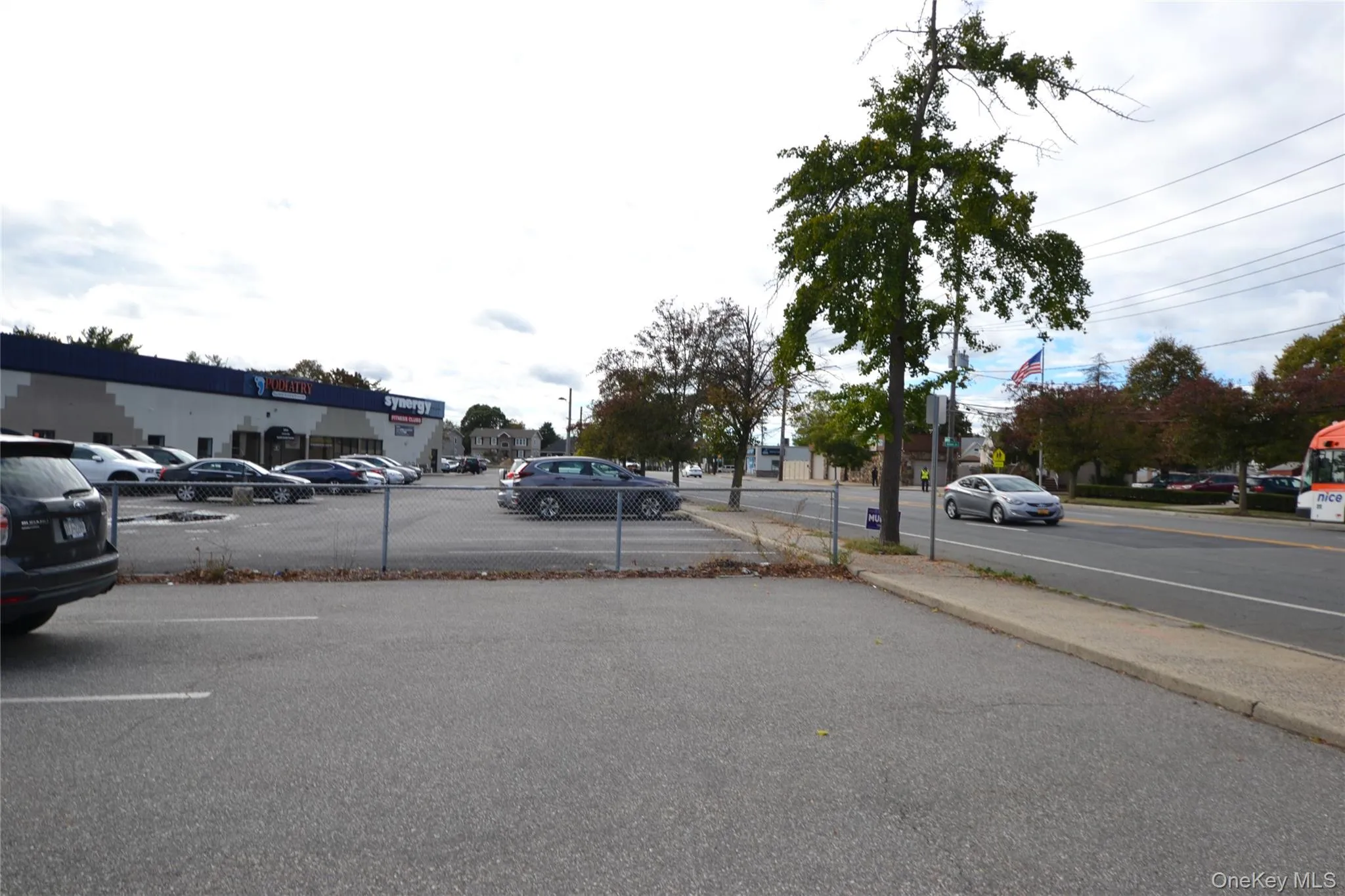 View of asphalt street featuring sidewalks and curbs View of asphalt street featuring sidewalks and curbs
