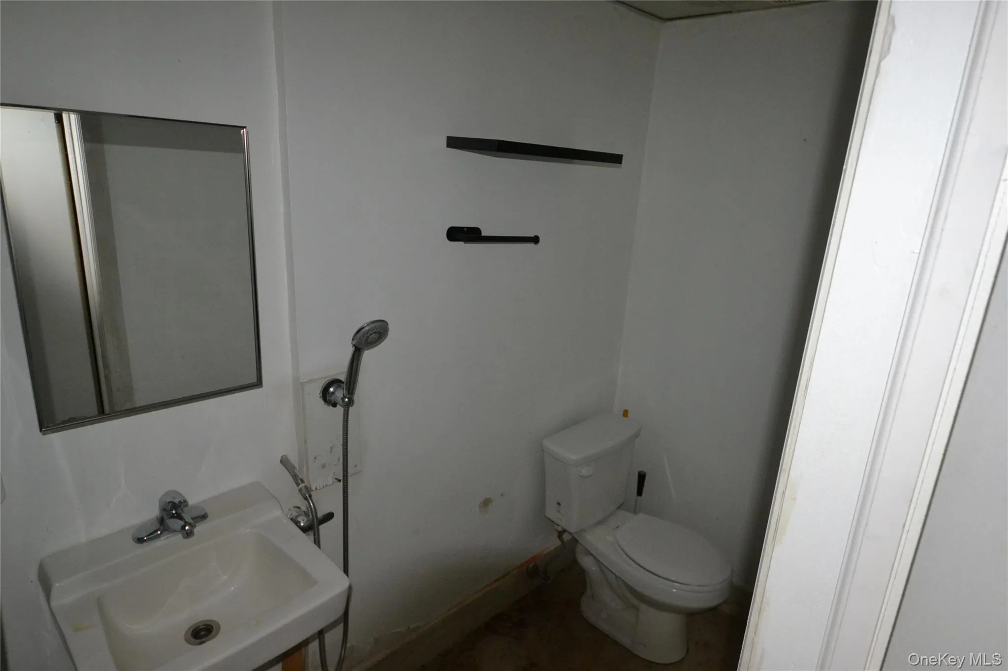 Half bath with toilet and a sink Half bath with toilet and a sink