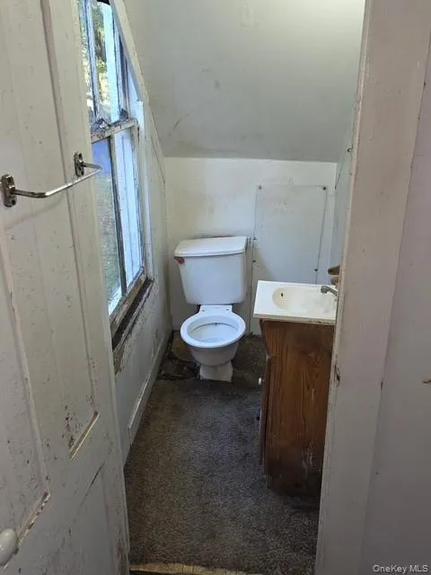 Bathroom featuring vanity and toilet Bathroom featuring vanity and toilet