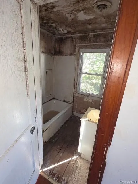 Bathroom with vanity and wood finished floors Bathroom with vanity and wood finished floors