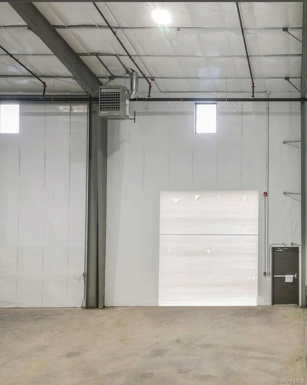 Garage featuring a heating unit Garage featuring a heating unit