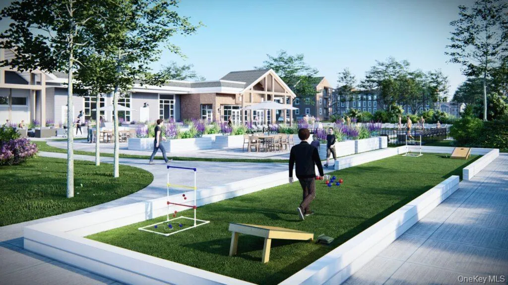 View of community featuring a patio area and a lawn View of community featuring a patio area and a lawn