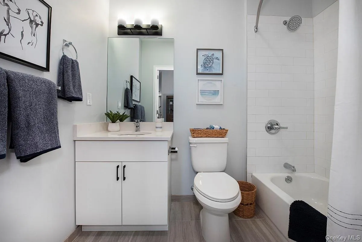 Full bathroom featuring shower / bath combo and vanity Full bathroom featuring shower / bath combo and vanity