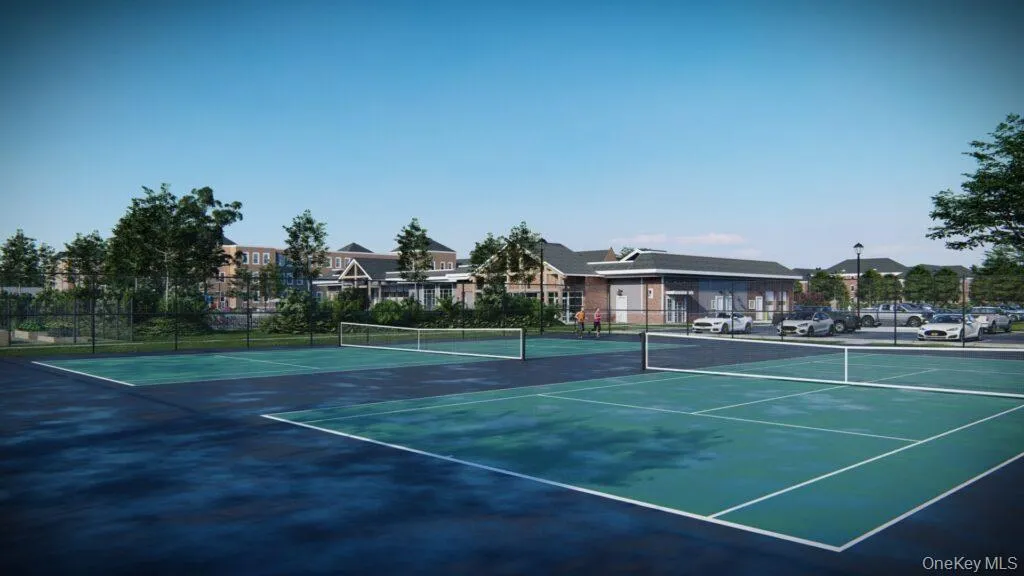 View of tennis court featuring a residential view View of tennis court featuring a residential view