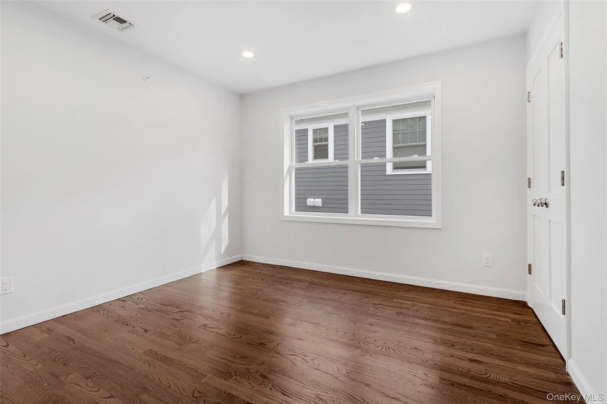 Unfurnished room featuring dark wood-type flooring and recessed lighting Unfurnished room featuring dark wood-type flooring and recessed lighting