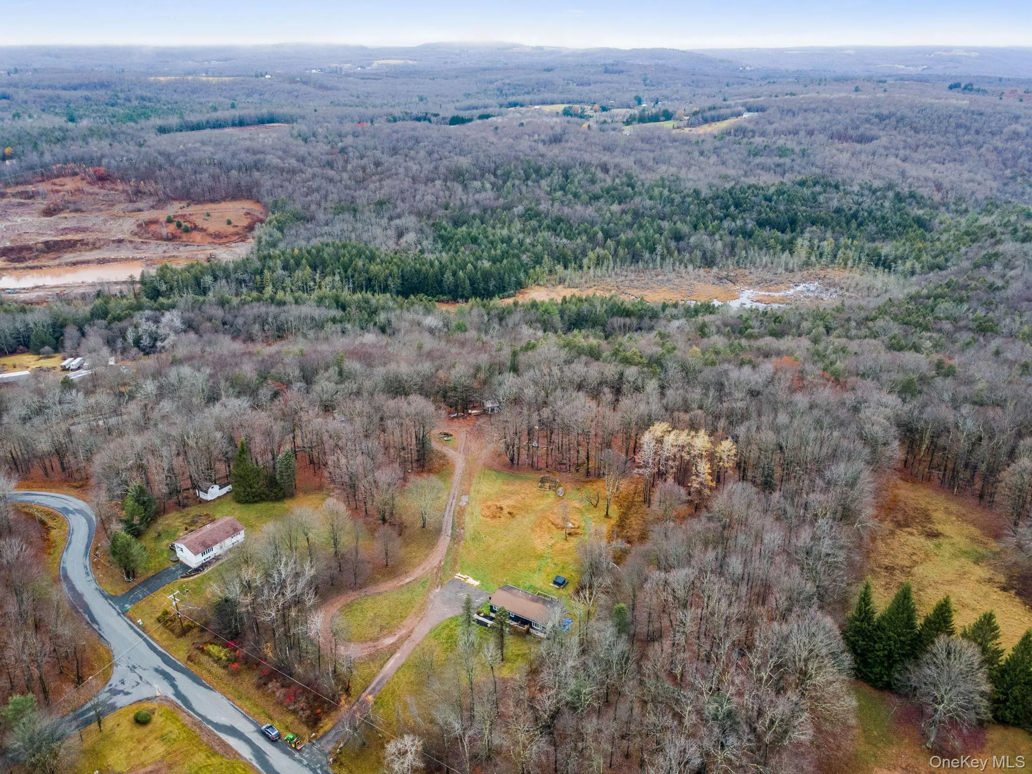 Aerial view of property's location featuring a forest Aerial view of property's location featuring a forest