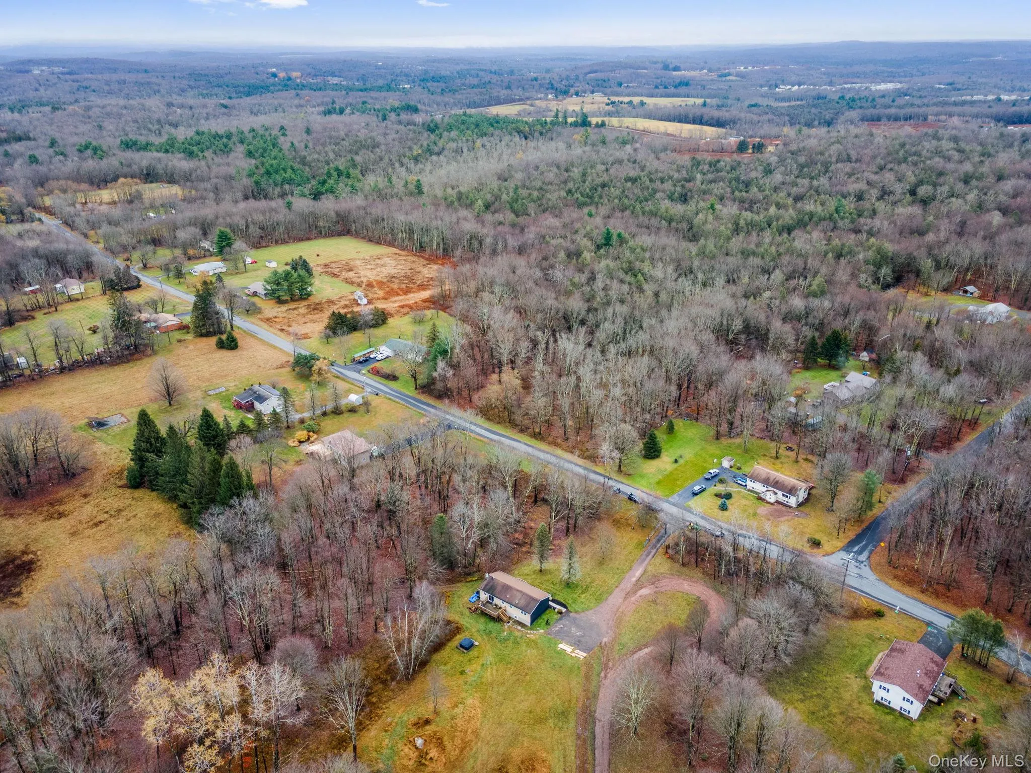 Aerial view of property's location featuring a forest Aerial view of property's location featuring a forest