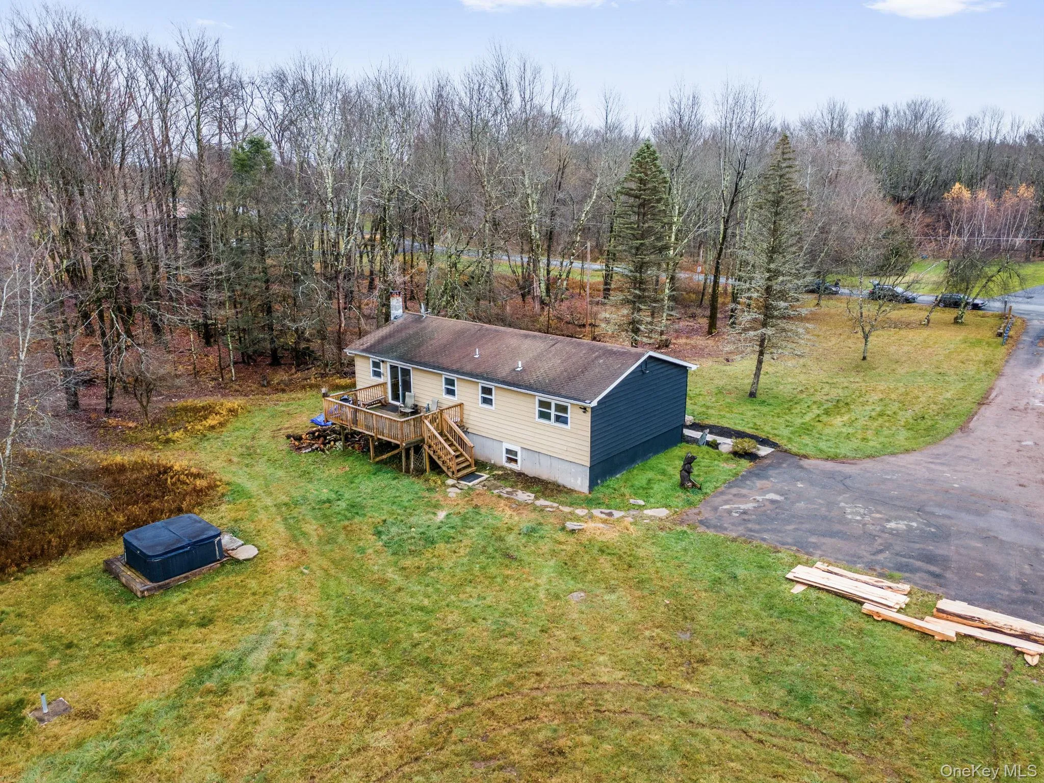 View from above of property featuring a heavily wooded area View from above of property featuring a heavily wooded area