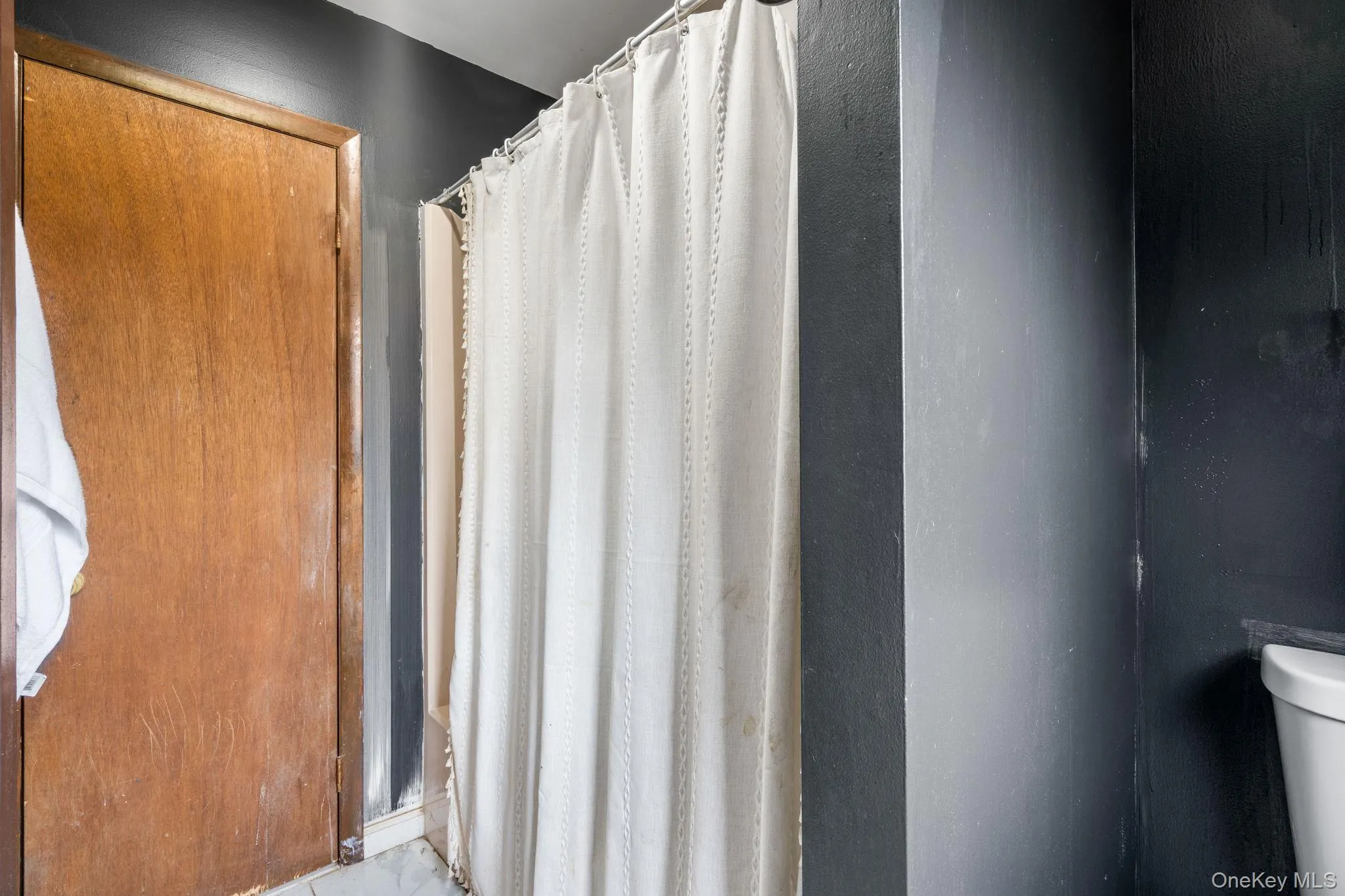 Bathroom with a shower stall and toilet Bathroom with a shower stall and toilet