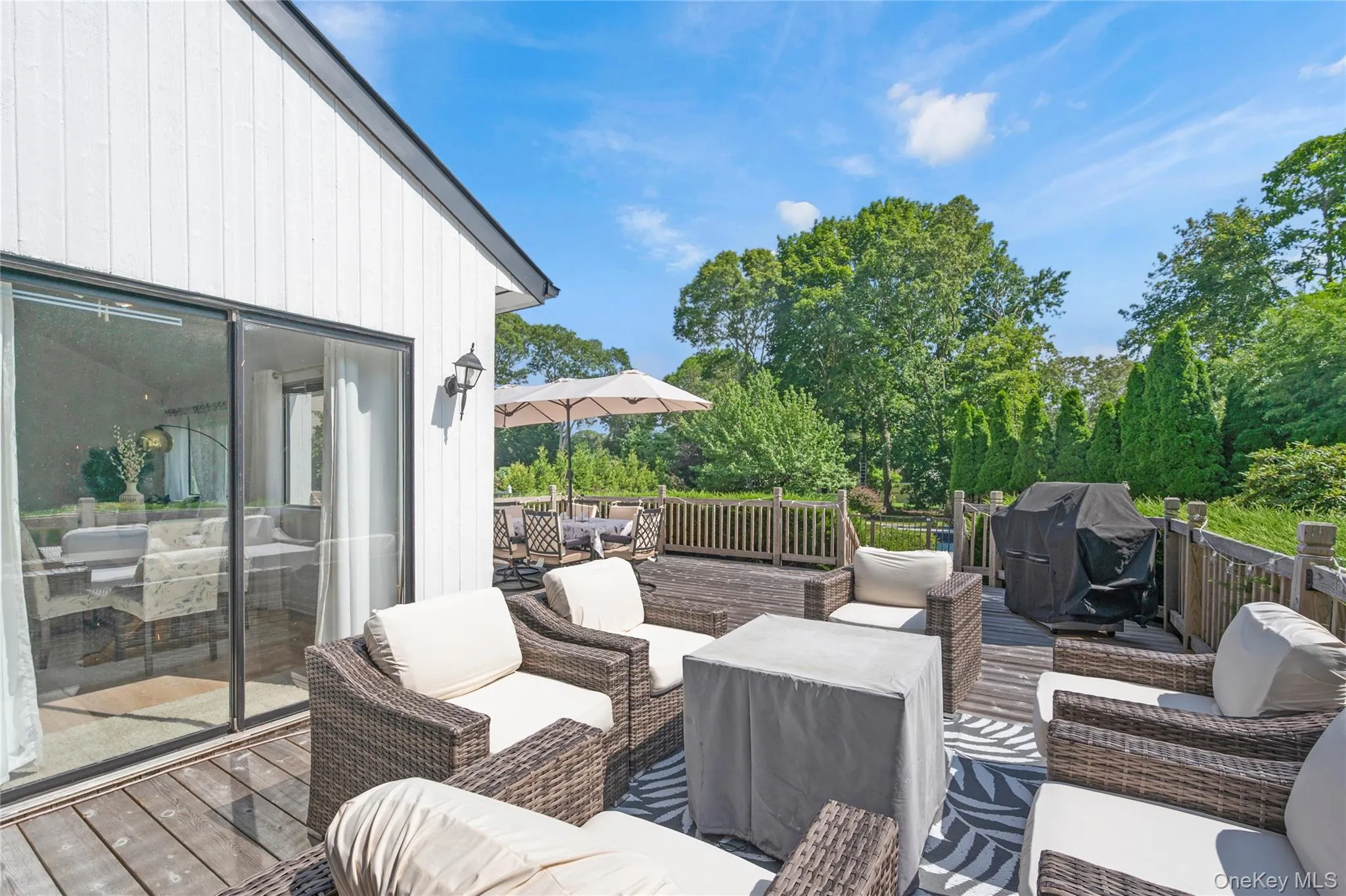 Deck featuring outdoor lounge area, outdoor dining and area for grilling Deck featuring outdoor lounge area, outdoor dining and area for grilling