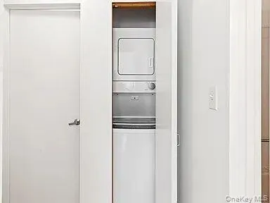 Washroom with stacked washer / dryer Washroom with stacked washer / dryer