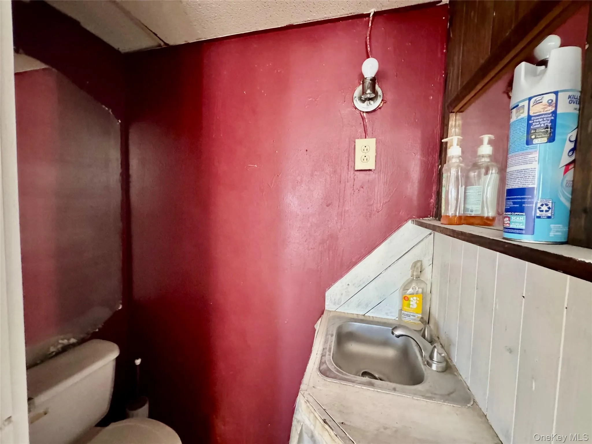 Half bath with vanity and toilet Half bath with vanity and toilet