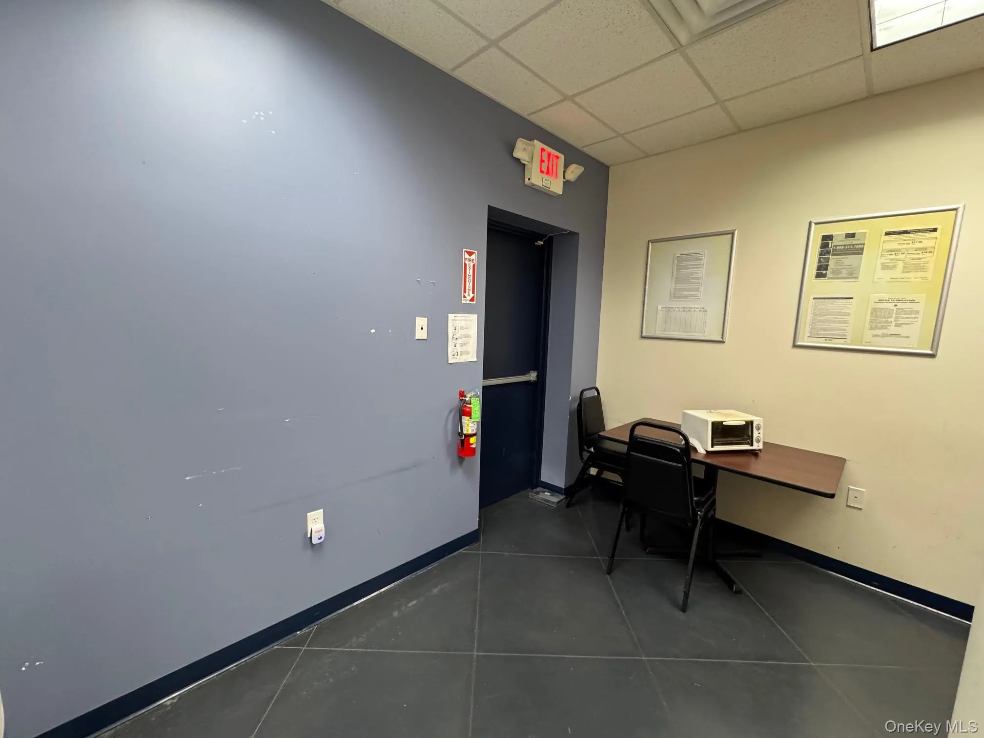 office with a drop ceiling office with a drop ceiling