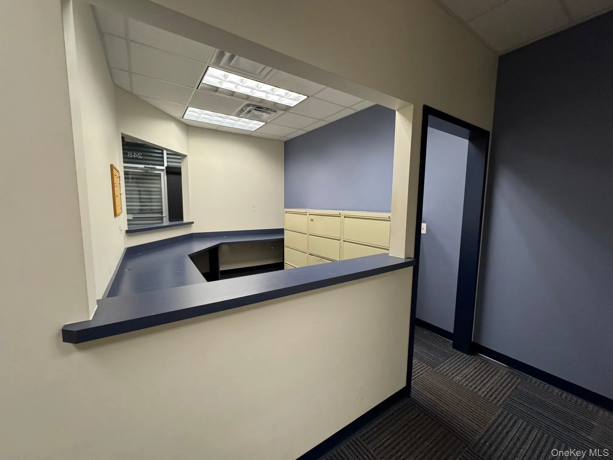 Unfurnished office featuring a drop ceiling Unfurnished office featuring a drop ceiling