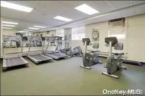 Exercise room featuring a drop ceiling Exercise room featuring a drop ceiling