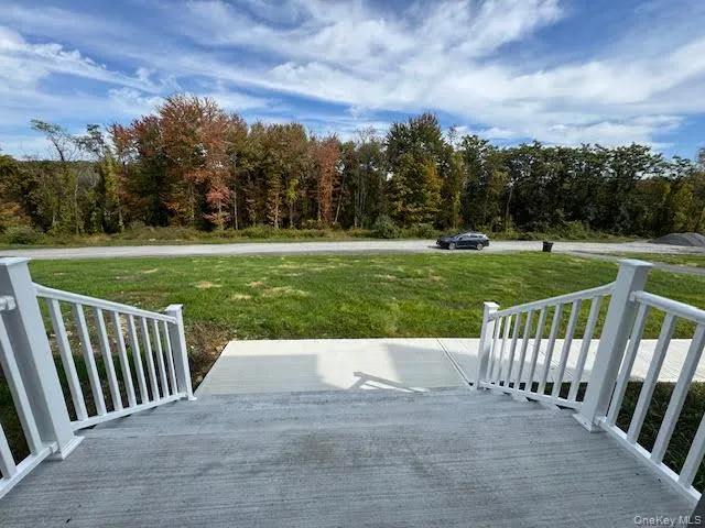 View of patio / terrace with a wooden deck and a view of trees View of patio / terrace with a wooden deck and a view of trees