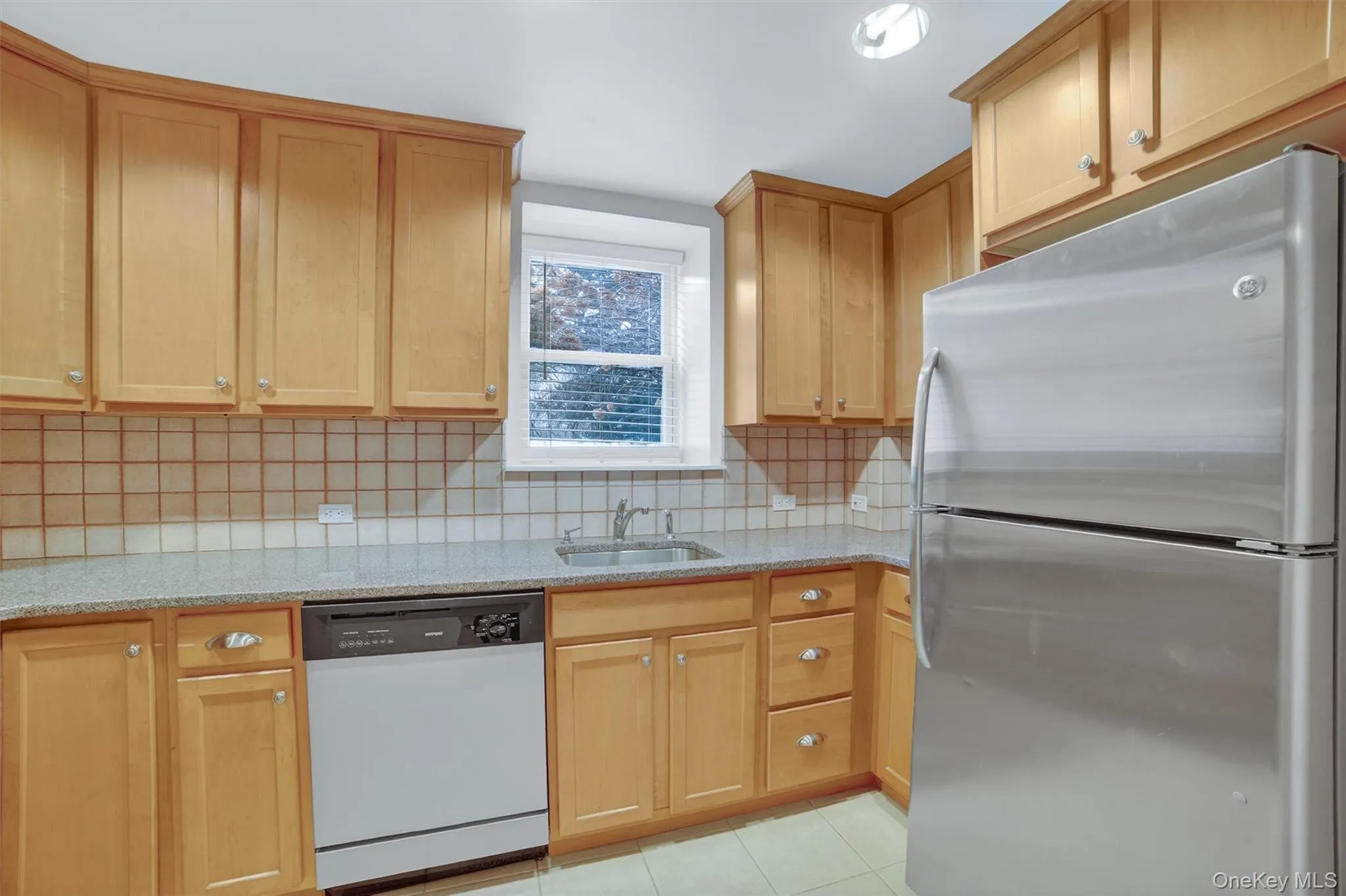 Natural sunlight fills the updated kitchen. Natural sunlight fills the updated kitchen.