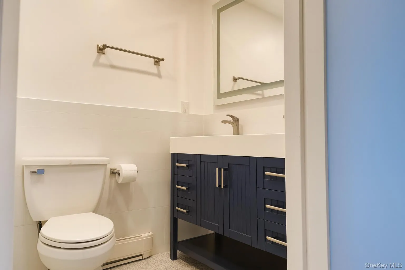 Half bath with vanity and toilet Half bath with vanity and toilet