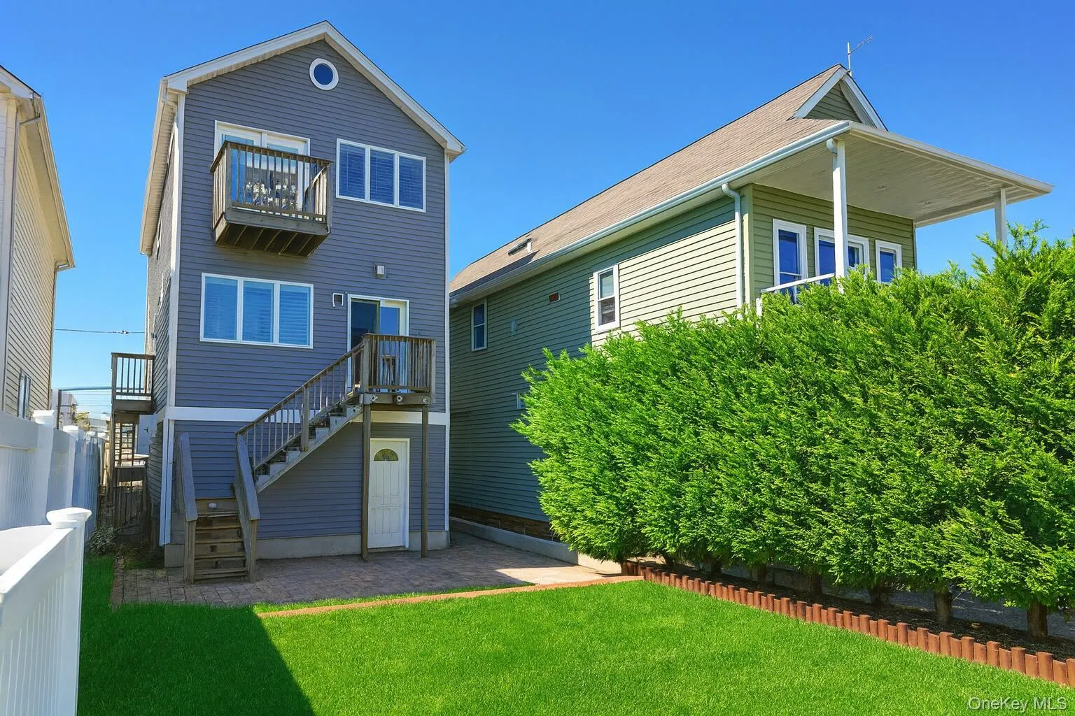 Back of house featuring stairway and a patio Back of house featuring stairway and a patio