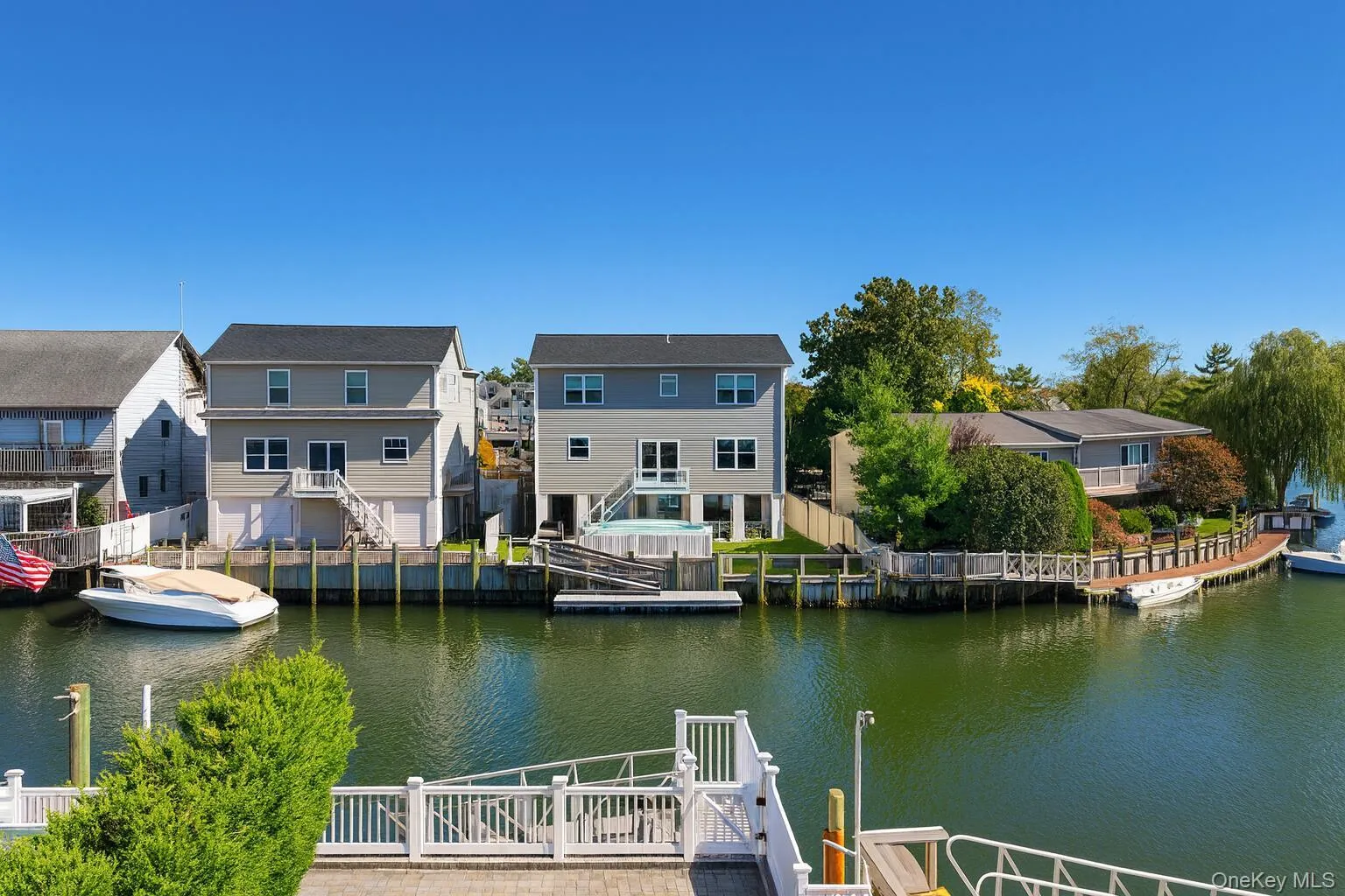 Dock area featuring a water view and a residential view Dock area featuring a water view and a residential view