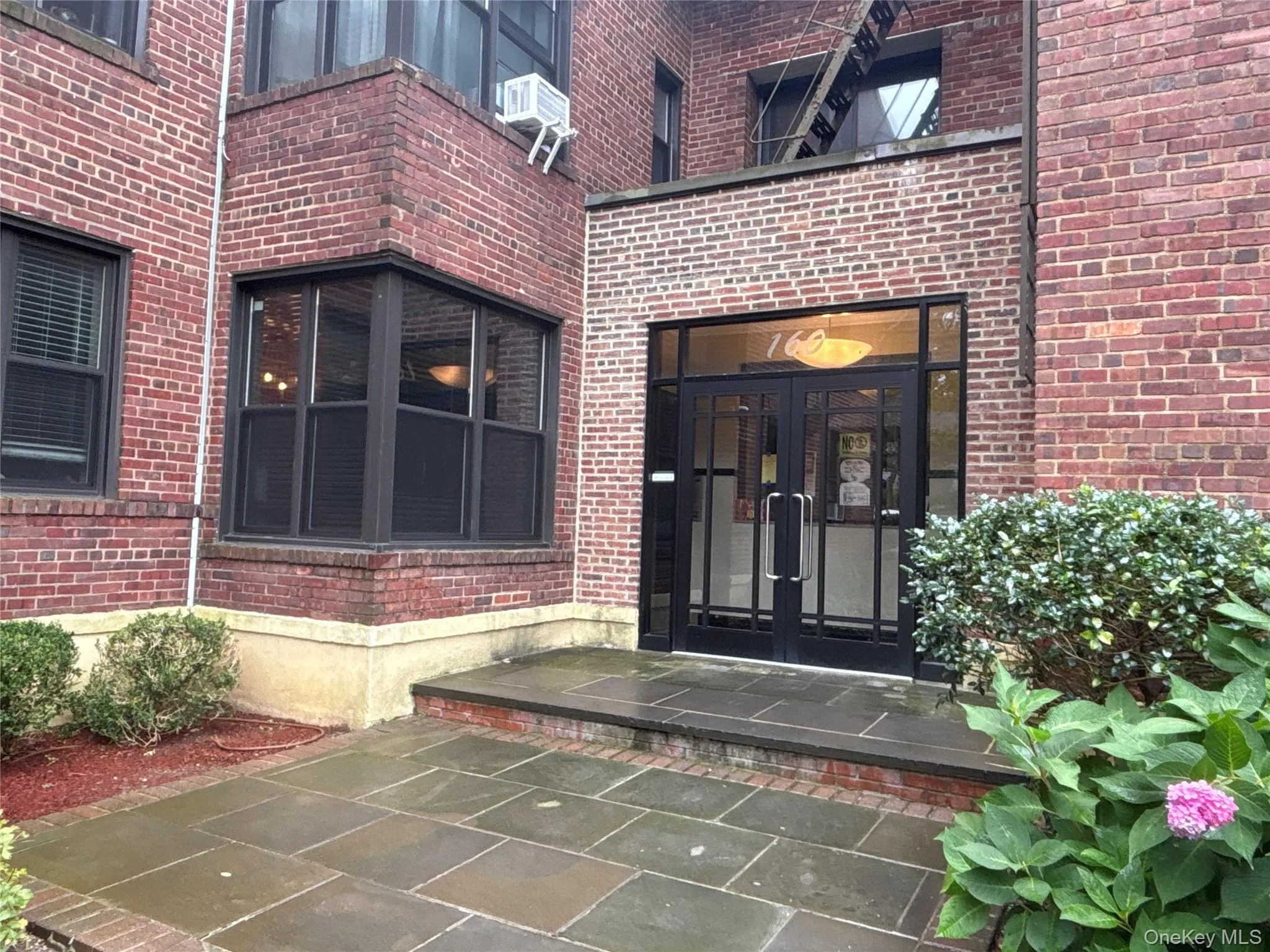 Entrance to property with french doors and brick siding Entrance to property with french doors and brick siding