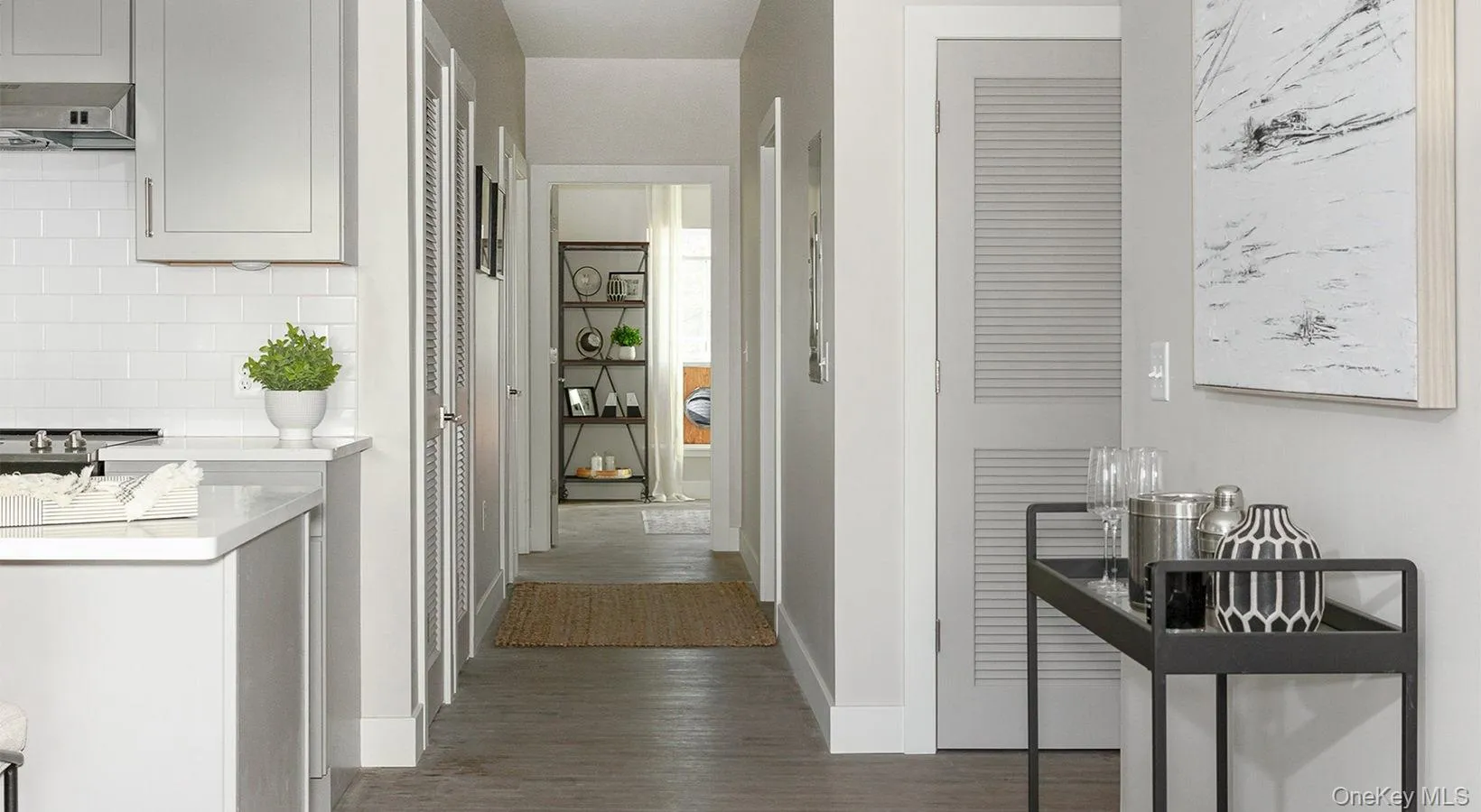 Corridor with baseboards and dark wood-style floors Corridor with baseboards and dark wood-style floors