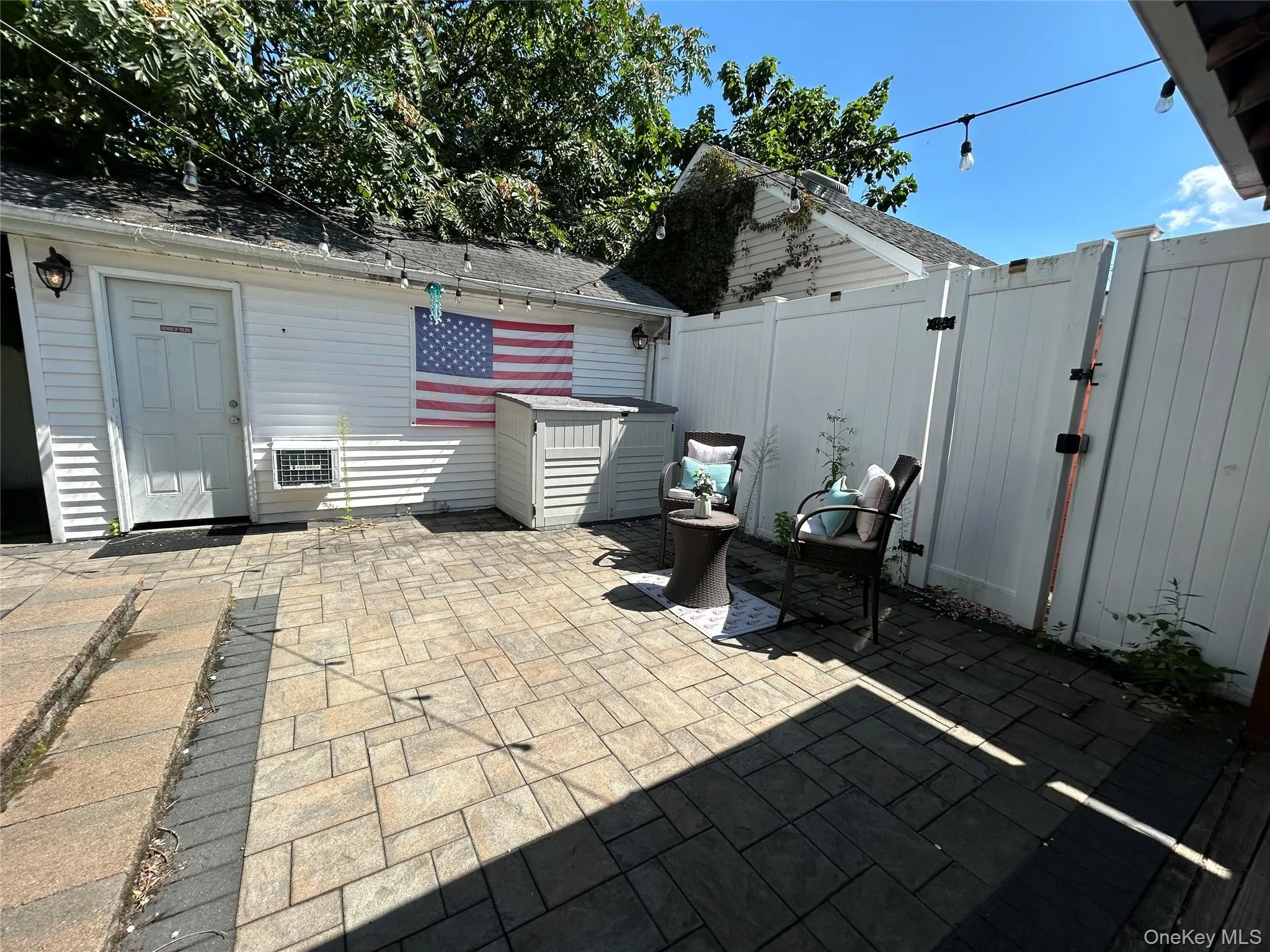 View of patio featuring a gate View of patio featuring a gate