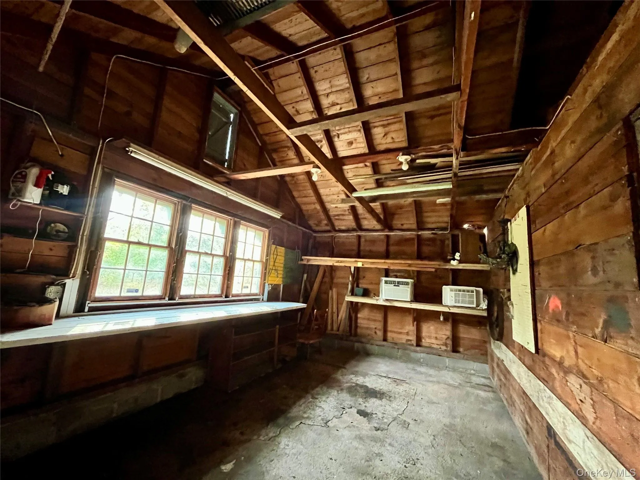 Attic with a wall mounted air conditioner Attic with a wall mounted air conditioner