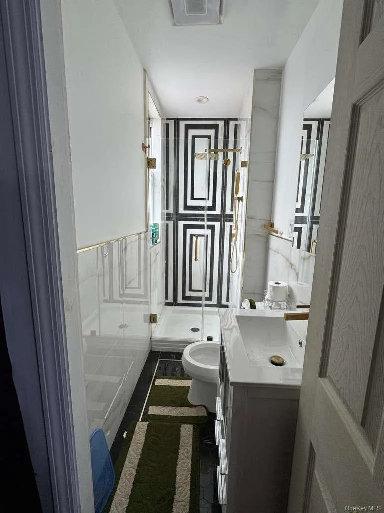 Full bathroom with vanity and a shower stall Full bathroom with vanity and a shower stall