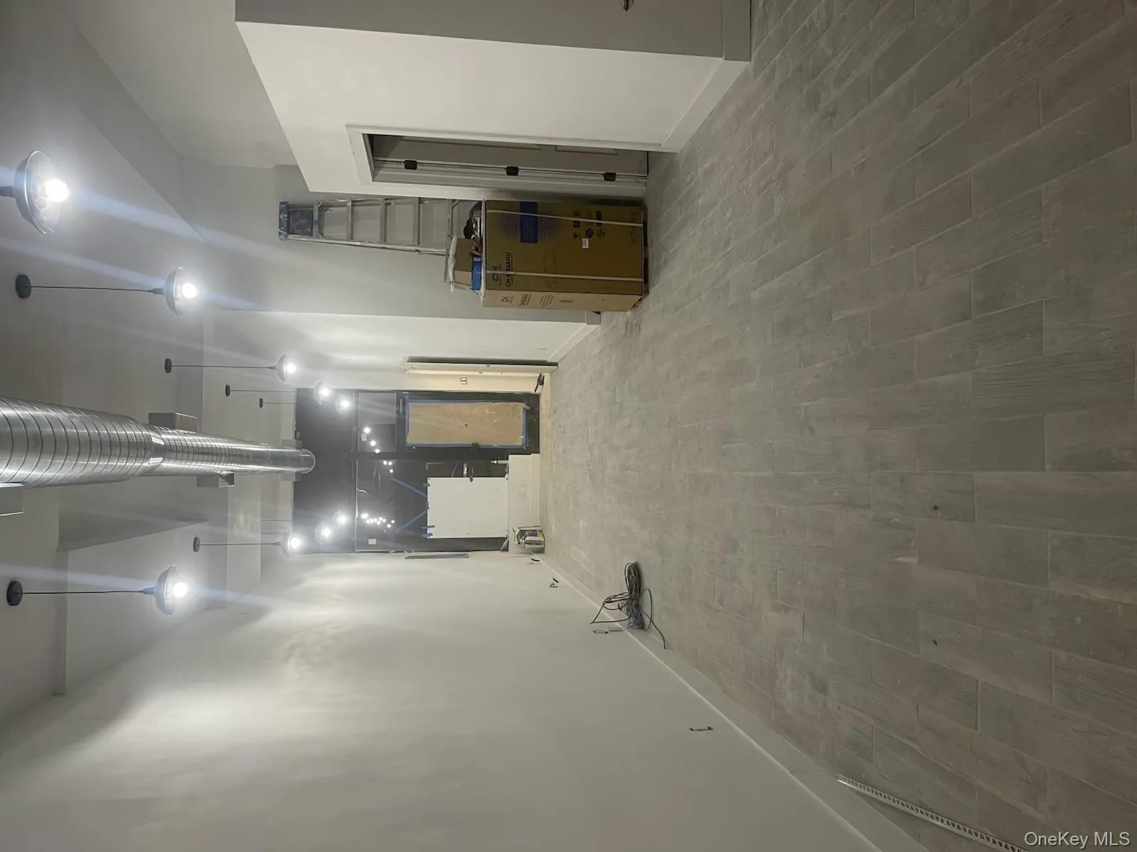 Basement with wood finished floors and baseboards Basement with wood finished floors and baseboards