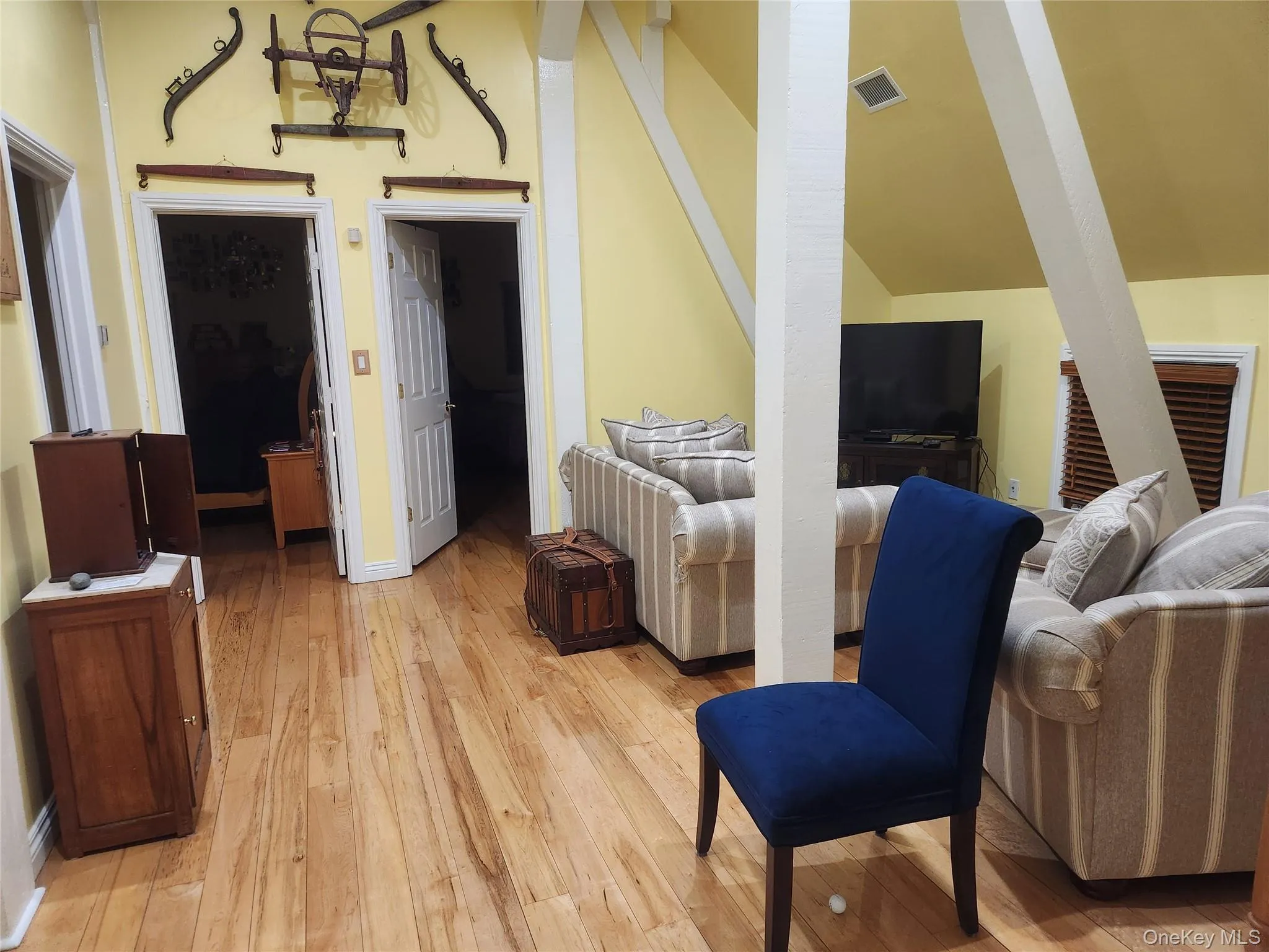 2nd Floor Central Sitting area with vaulted ceiling and light hardwood / wood-style flooring 2nd Floor Central Sitting area with vaulted ceiling and light hardwood / wood-style flooring