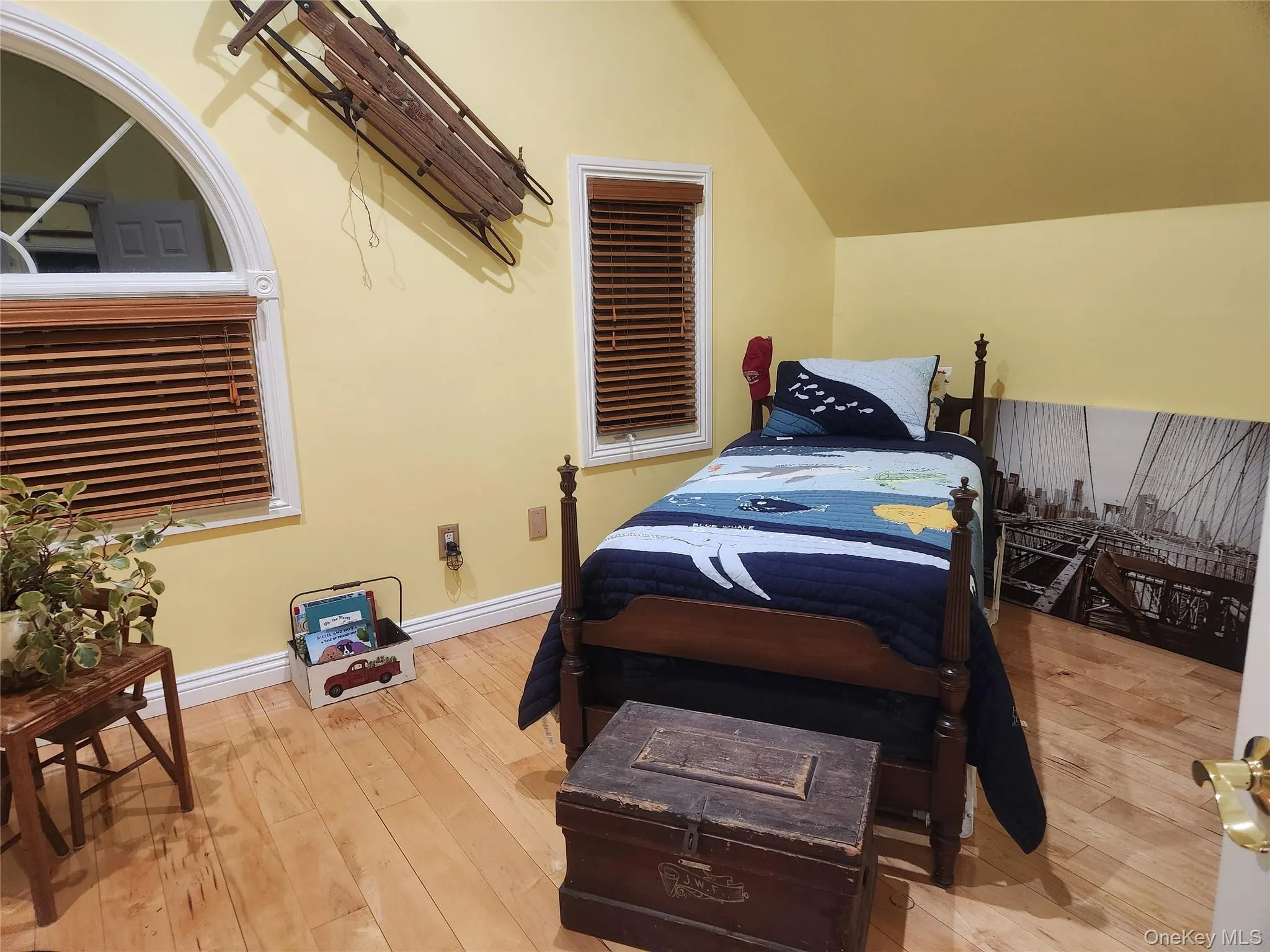 2nd Bedroom featuring vaulted ceiling and light hardwood / wood-style flooring 2nd Bedroom featuring vaulted ceiling and light hardwood / wood-style flooring
